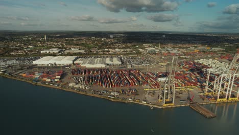 test river with deep-sea container terminal at southampton in england, uk