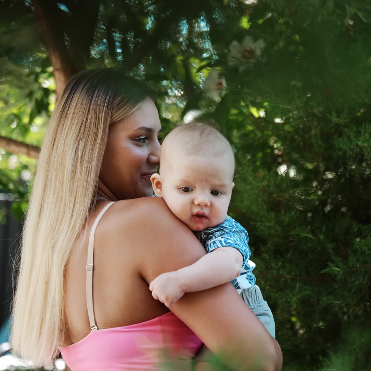 Happy parents nature having fun outdoor. Summer family vacation with newborn baby