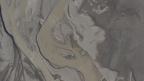 directly above curvy aragvi river bed and terrain, georgia, approaching aerial
