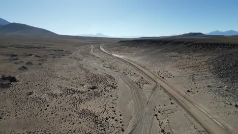 vehicle traveling on dirt road near eduardo avaroa national reserve, bolivia