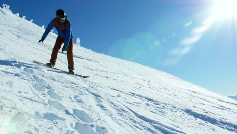 Person-snowboarding-on-snowy-mountain