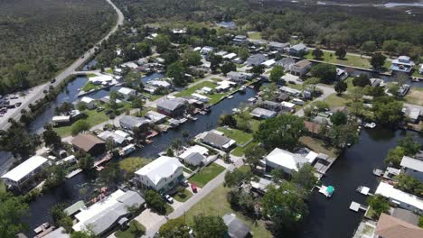 the-many-homes-and-canals-running-through-Weeki-Wachee-Gardens,-a-subdivision-in-Weeki-Wachee,-Gulf-Coast-of-Florida