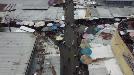 low aerial flyover: galeria central street market in san salvador