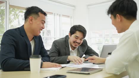 slow motion scene group of multi ethnicity businessmen of marketing team consulting and meeting together about great and profit annual in private room at office for business conference concept