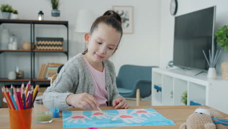 girl painting handprints
