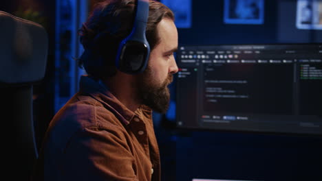 computer scientist listening music while writing lines of code, extreme close up