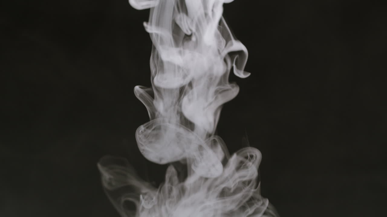 Hand Lifts Glass Container Releasing White Smoke