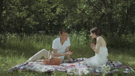 loving man proposing to his excited girlfriend