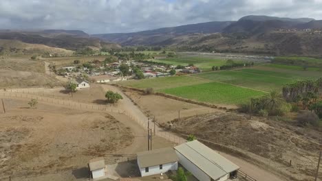 the mission "el descanso", rosarito baja california, a wide view of mountains, sky, local agriculture, poblado mision del descanso