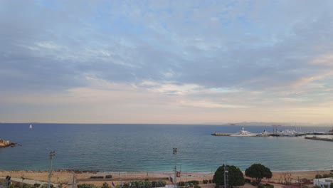 Calm-Mediterranean-sea-sandy-beach-coast,-elevated-view-Piraeus-Athens-Greece