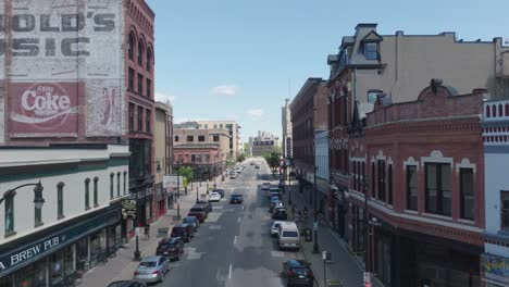 aerial view of a city street with old buildings and cars