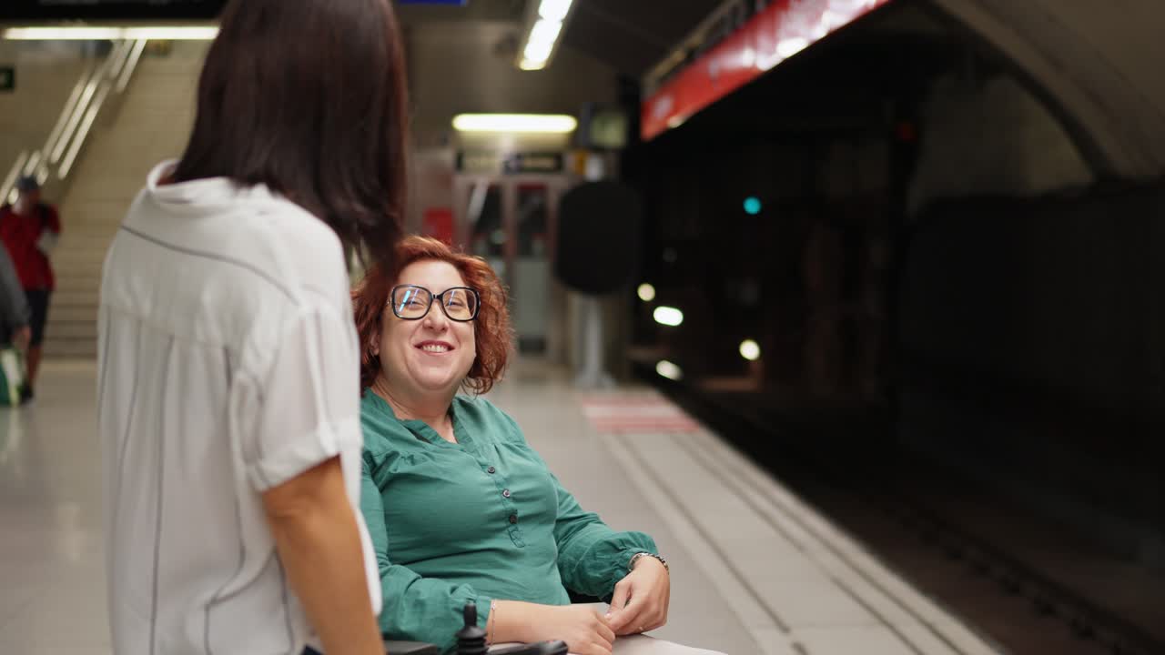 Woman in wheelchair at subway station