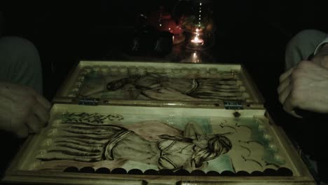 hand-painted backgammon set at night