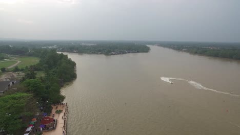 aerial shot of surat thani, river and city surat thani province, thailand