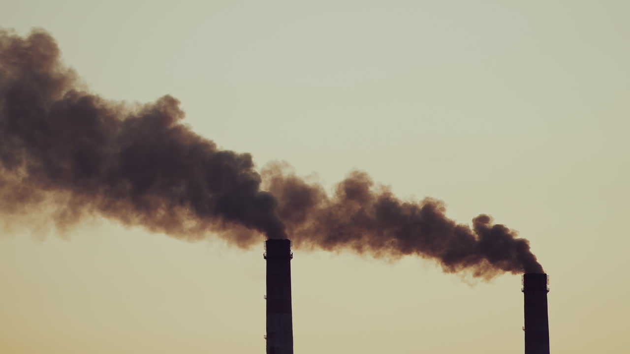 Air emissions from an industrial pipe. Stack releasing smoke and pollution to the atmosphere