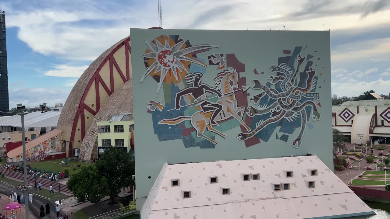 Aerial view of the Science city building with Graphiti and city scape in the background.