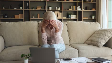 frustrated mature woman manage finances, feeling stressed due bank debt