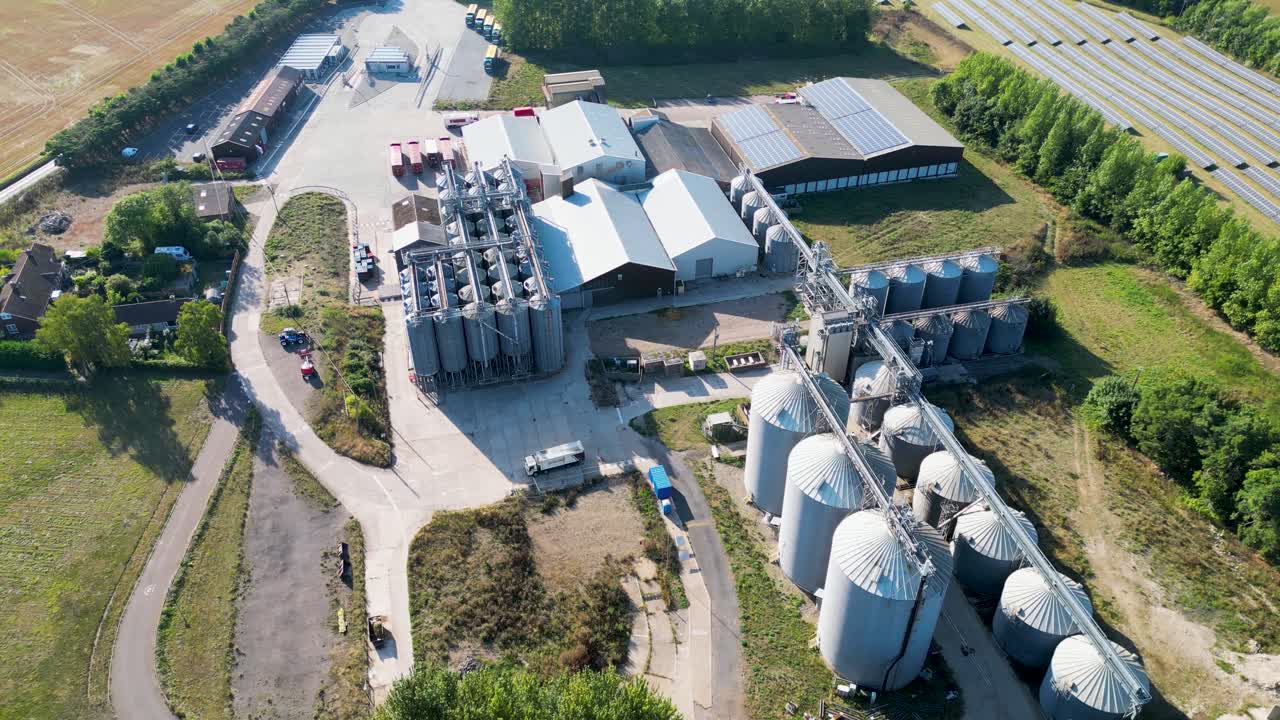 Aerial drone shot of an industrial plant in the middle of countryside