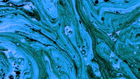 colorful oil drops floating on water surface, top view. fantastic abstract background. bright bubbles moving and spreading. close up 4k video of weird liquid structures. scientific chemical experiment