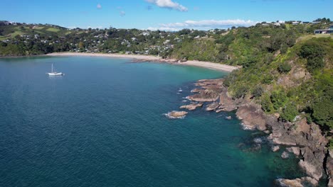 flying towards palm beach and little palm beach on waiheke island in auckland, new zealand