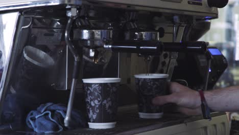 barista making espresso in a coffee shop