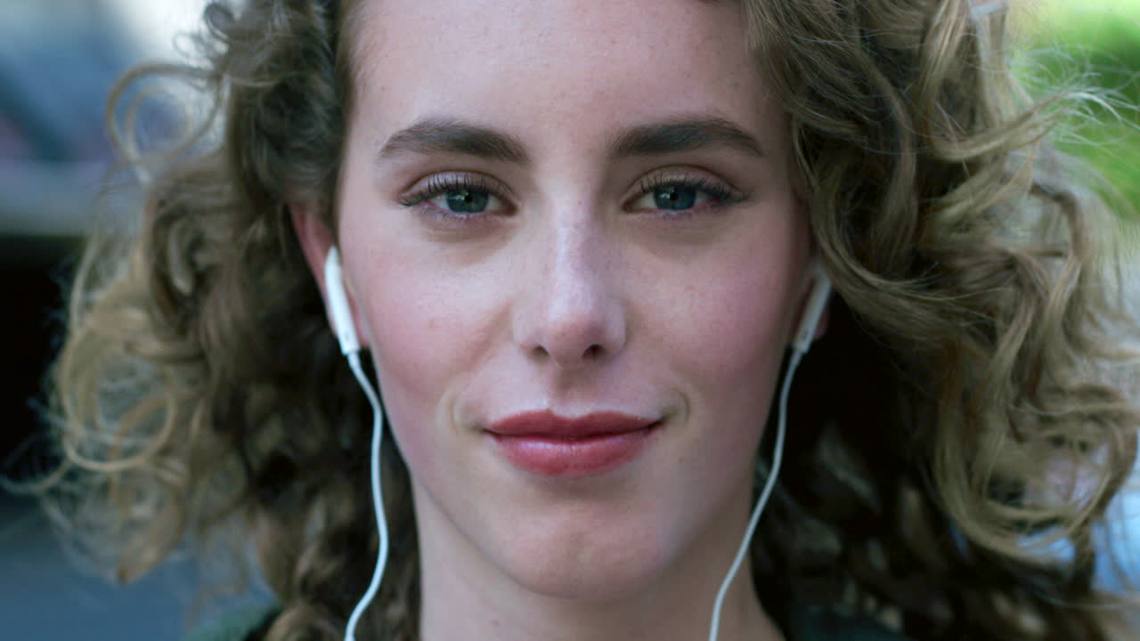 Portrait of young woman listening to music