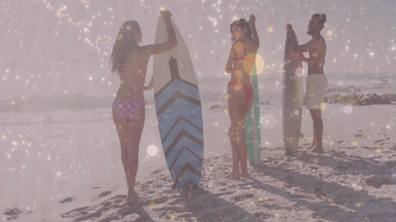 Three surfers standing on beach holding surfboards, showing health data using animated wave chart