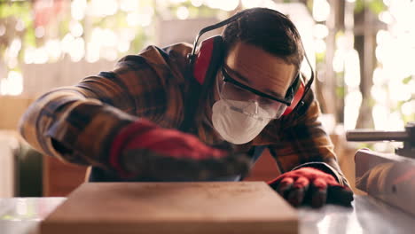 wood, carpenter and dust with man in workshop