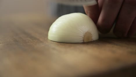 Half-an-onion-being-diced