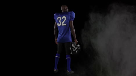 animación de polvos coloridos sobre un jugador de fútbol americano