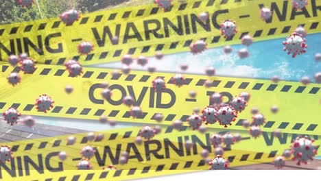 video compuesto digital de cintas amarillas de la policía con texto de advertencia de covid-19 y células de covid-19 en movimiento