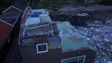 remains of badly destroyed terraced houses under demolishment orders