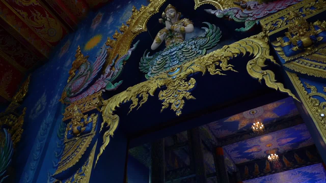 Decoration of the main entrance to the prayer house at Wat Rong Sear Tean (Blue Temple). Chiang Rai, Thailand.