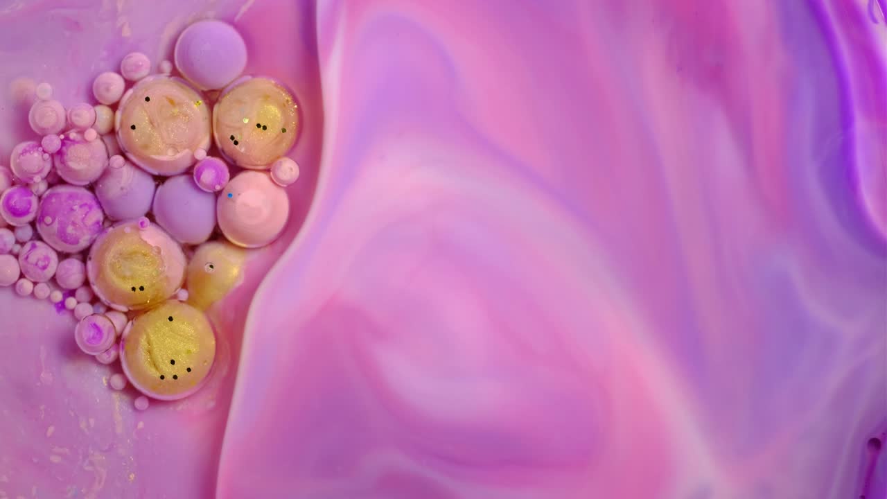 Colorful paint and bubbles abstract background 4k video