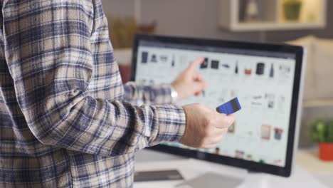 man using instant mobile payment holding credit card. online shopping.