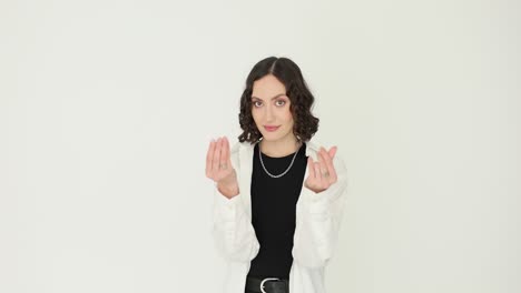 young woman making hand gestures on white background