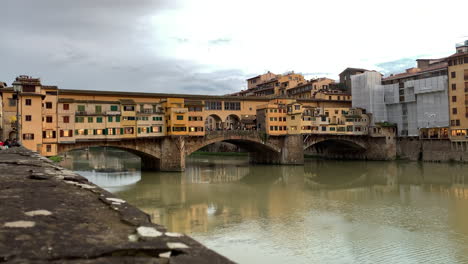 slow pan right shot of ponte vecchio on cloudy day