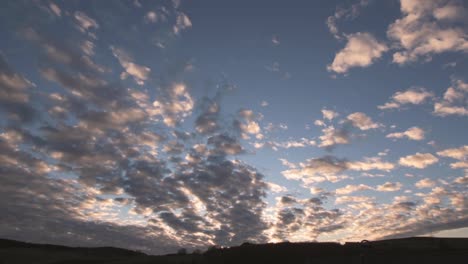 still-timleapse-shot-of-clouds-moving-to-the-right-at-sunset