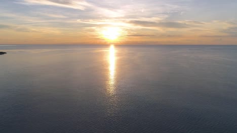 paddleboarding at sunset