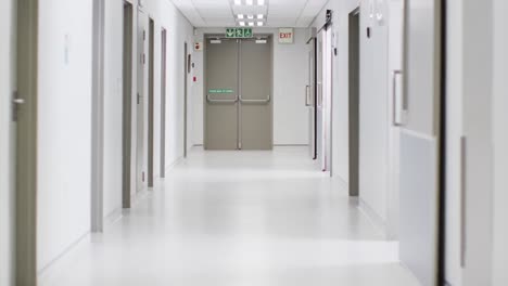 video of brightly lit, clean, empty corridor in modern hospital, with copy space