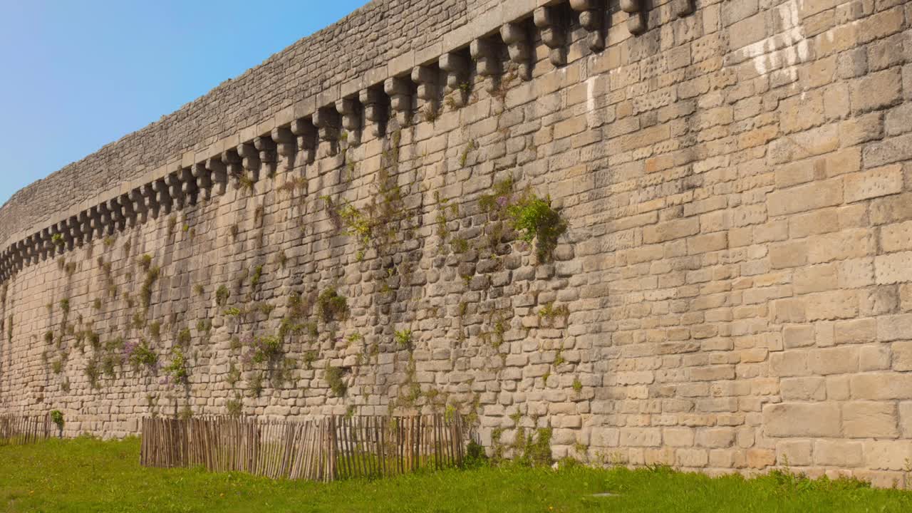 Old Stone Fortress Wall In Medieval Town Of Guerande In Pays de la Loire, France. lateral view