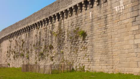 old stone fortress wall in medieval town of guerande in pays de la loire, france. lateral view