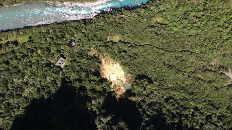 Aerial-view-of-Welcome-Flat-Hut-and-hot-pools,-Copland-River-track-in-New-Zealand,-beautiful-landscape