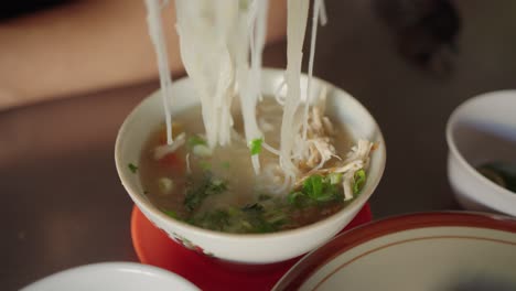 bowl of indonesian chicken noodle soup