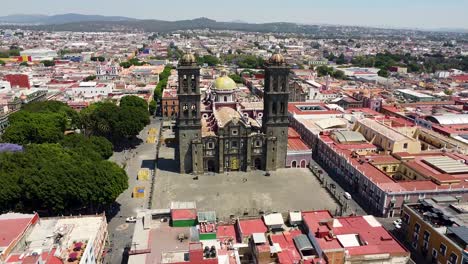 aerial of historic catholic church with spires and dome in oaxaca de juarez - mexico