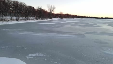 ice layer over a lake in minneapolis, winter