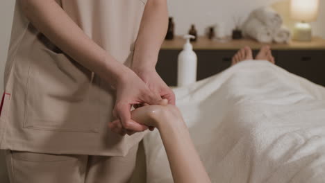 close-up of a professional hand massage in a spa setting