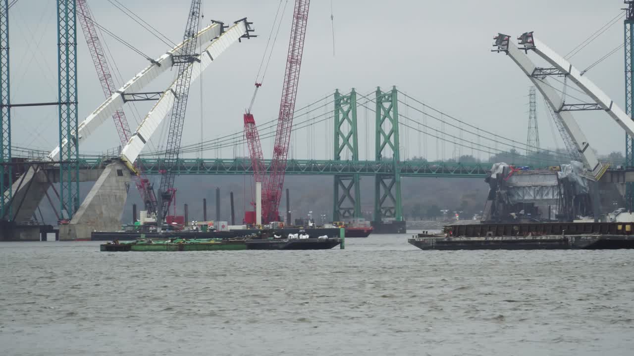 Idled Construction of I-74 Bridge Over the Mississippi River at Quad Cities; delays caused by monetary contract disputes, potential design errors, labor shortages and poor weather