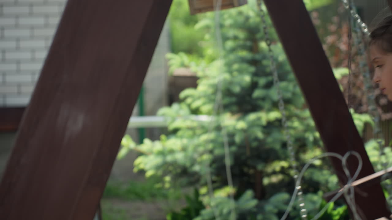 Child Playing Beside Cheerful Pet, Young Girl Rests As Dog Watches Closely, Seated Girl In Garden With Her Friendly Dog Nearby, Girl Sitting Peacefully In Garden While Her Lively Dog Keeps Watch