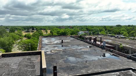 Drone-exploring-an-old-rooftop-of-a-factory